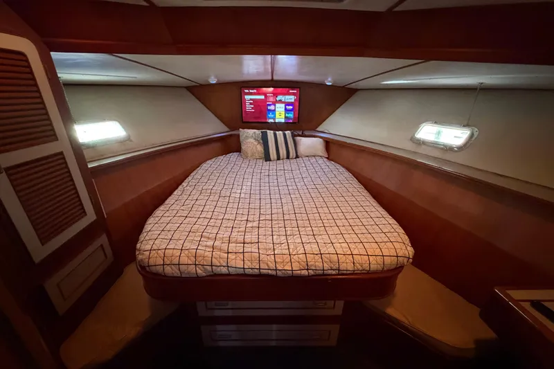 Slide: The Image of Cozy cabin interior of 1987 Hi-Star 55 Yacht Fisherman with bed and TV. - 44