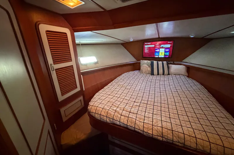 Slide: The Image of Cozy bedroom in 1987 Hi-Star 55 Yacht Fisherman with TV and wooden cabinetry. - 46