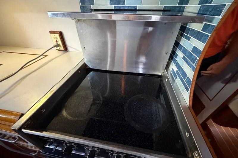 Slide: The Image of Electric stove in 1987 Hi-Star 55 Yacht Fisherman kitchen with tiled backsplash. - 52