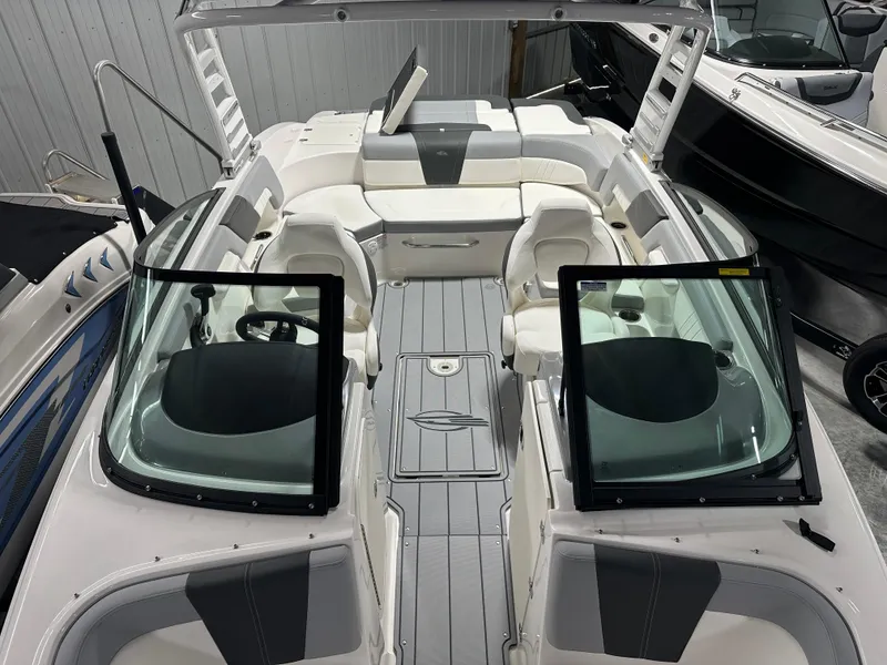 Slide: The Image of 2025 Chaparral 23 SSi boat interior with sleek seating and modern design. - 14