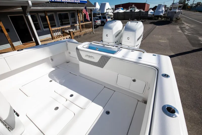 Slide: The Image of 2023 Invincible 33 Open Fisherman boat with dual outboard engines. - 7