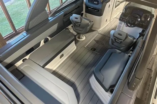 Slide: The Image of Interior of 2025 Chaparral 2870 SSX boat with modern seating and sleek design. - 13