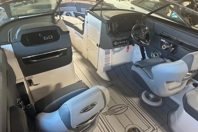 Slide: The Image of Interior of 2025 Chaparral 2870 SSX boat with modern seating and dashboard. - 14