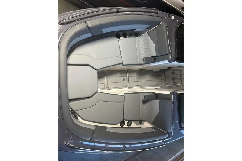 Slide: The Image of 2025 Chaparral 2870 SSX boat interior with gray seating and spacious layout. - 6