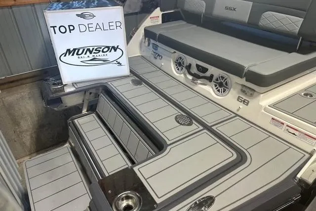 Slide: The Image of 2025 Chaparral 2870 SSX boat deck with seating and Munson top dealer award. - 9