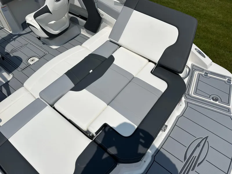 Slide: The Image of 2025 Chaparral 21 SSi boat interior with gray and white seating and flooring. - 12