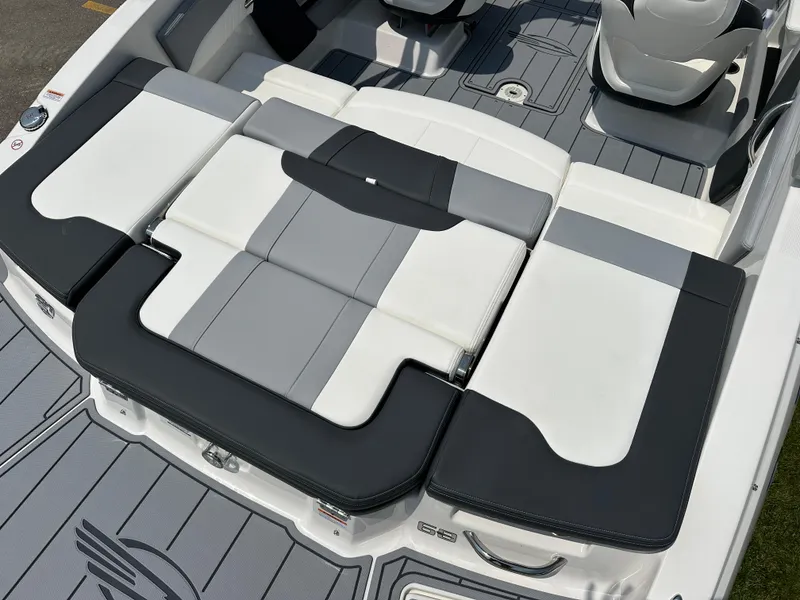 Slide: The Image of 2025 Chaparral 21 SSi boat interior with sleek, modern seating design. - 14
