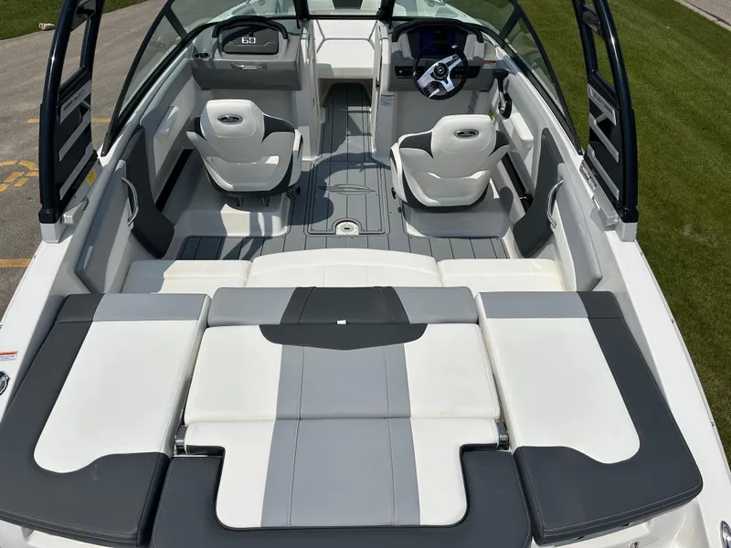 Slide: The Image of 2025 Chaparral 21 SSi boat interior with modern seating and sleek design. - 15