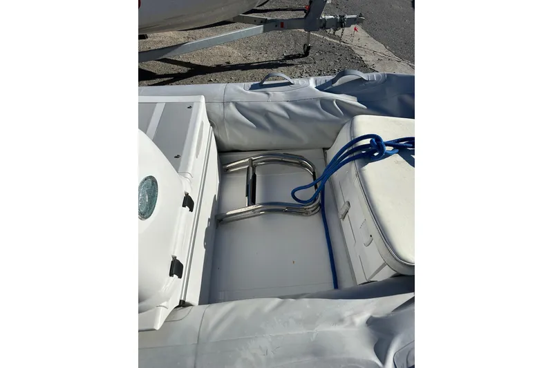 Slide: The Image of 2016 Walker Bay 325 ST inflatable boat interior with blue rope and metal ladder. - 15