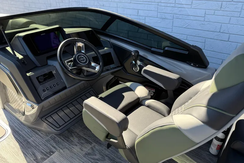 Slide: The Image of 2026 Avalon 2385 Catalina QLS Windshield boat interior with modern steering and controls. - 13