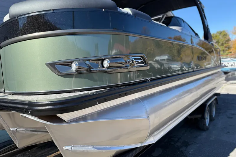 Slide: The Image of 2026 Avalon 2385 Catalina QLS Windshield pontoon boat, sleek design with metallic accents. - 4