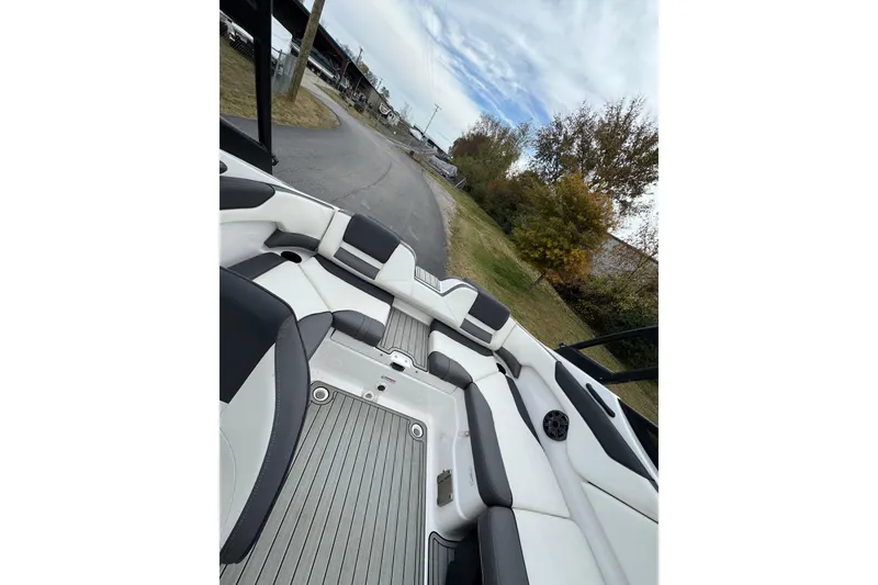 Slide: The Image of 2021 Yamaha AR210 boat interior with sleek seating and modern design. - 5