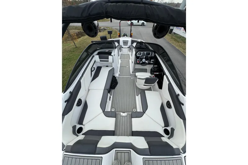 Slide: The Image of 2021 Yamaha AR210 boat interior with sleek seating and modern dashboard design. - 7