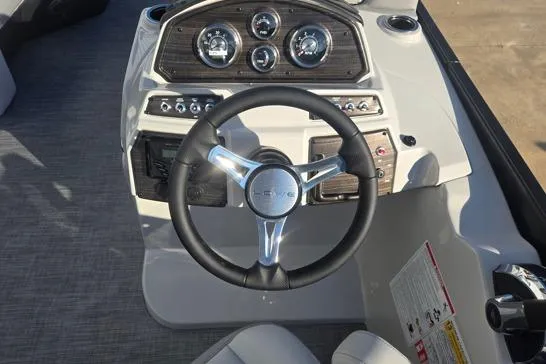 Slide: The Image of Steering console of 2026 Lowe SS 230 DV boat with modern gauges and controls. - 11