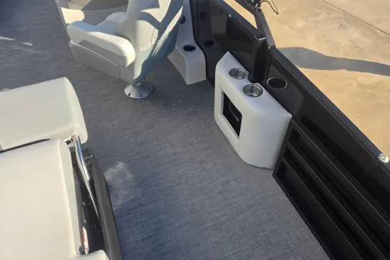Slide: The Image of 2026 Lowe SS 230 DV boat interior with seating and cup holders. - 13