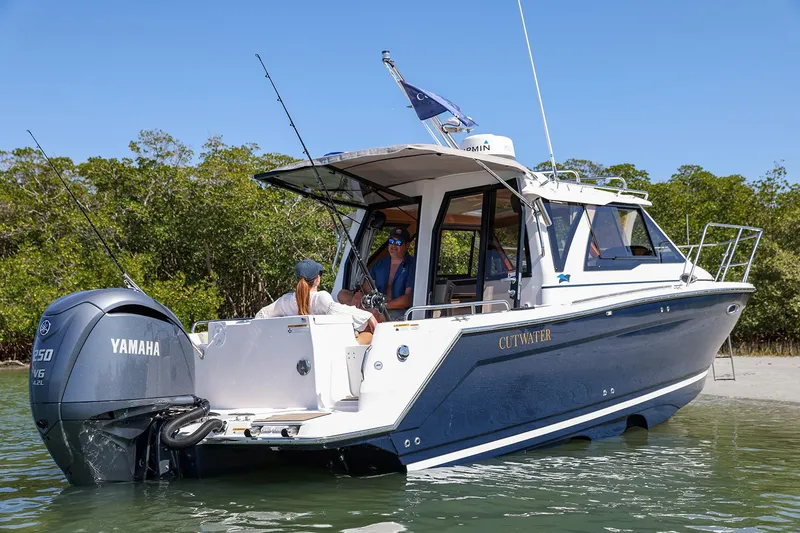 Slide: The Image of Manufacturer Provided Image: 2025 Cutwater C-248 Coupe boat with Yamaha engine on calm water. - 3