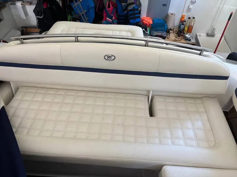 Slide: The Image of Interior of a 2021 Cobalt R3 Surf boat with white upholstered seating. - 3