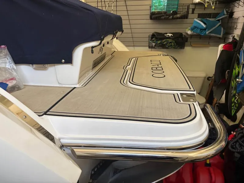 Slide: The Image of 2021 Cobalt R3 Surf boat in storage area. - 6