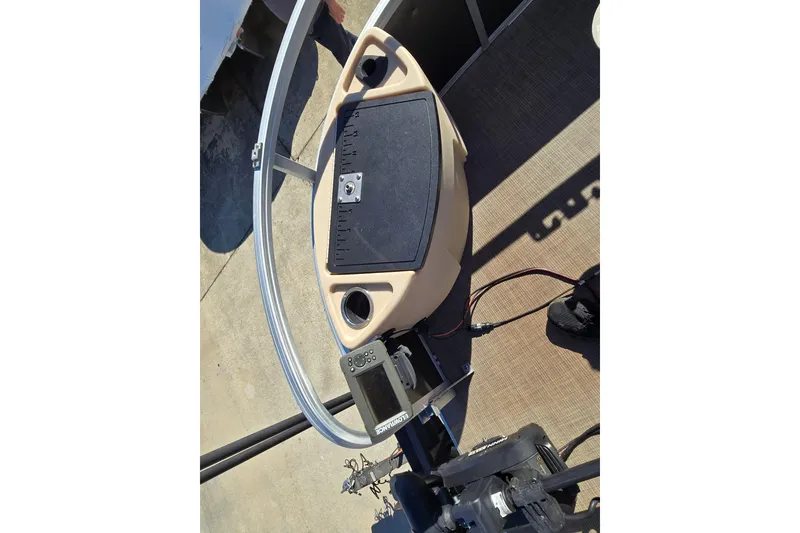 Slide: The Image of 2019 Sun Tracker Fishin' Barge 22 XP3 steering console with mounted electronics. - 11