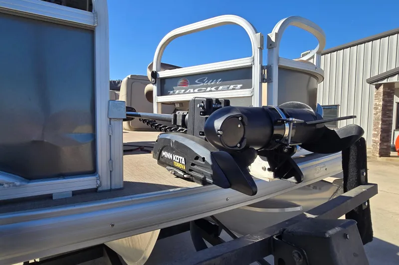 Slide: The Image of 2019 Sun Tracker Fishin' Barge 22 XP3 with Minn Kota Terrova motor, docked outdoors. - 14