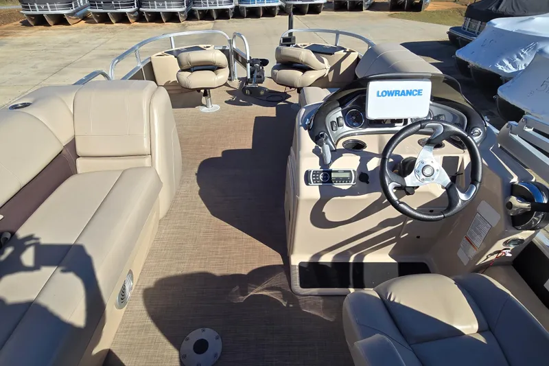 Slide: The Image of 2019 Sun Tracker Fishin' Barge 22 XP3 interior with steering console and seating. - 5