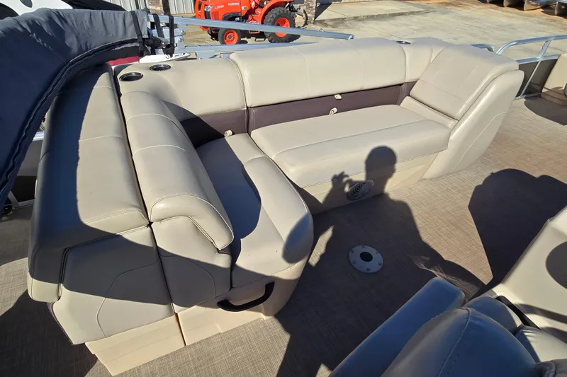Slide: The Image of 2019 Sun Tracker Fishin' Barge 22 XP3 interior seating with beige upholstery. - 6