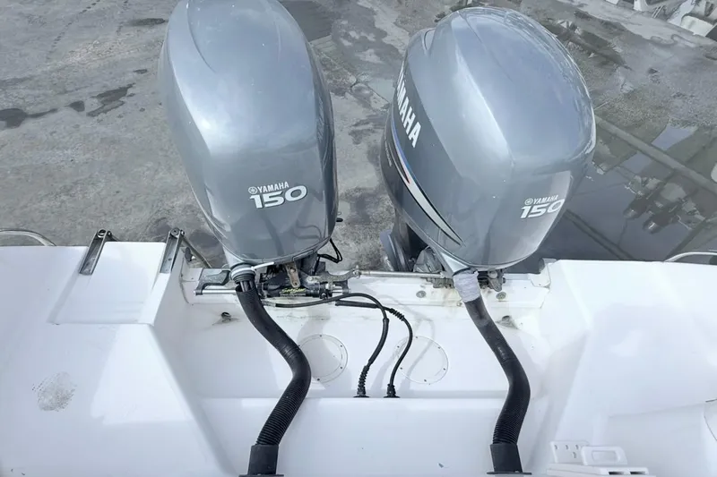 Slide: The Image of Twin Yamaha 150 outboard engines on a 2005 Grady-White Journey 258 boat. - 26