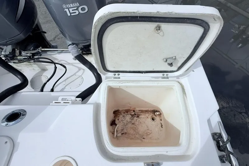 Slide: The Image of Open storage compartment on a 2005 Grady-White Journey 258 boat. - 27