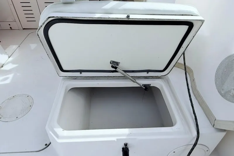 Slide: The Image of Open storage compartment on 2005 Grady-White Journey 258 boat deck. - 29