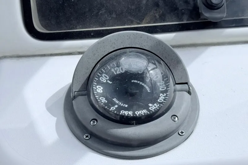 Slide: The Image of Compass on 2005 Grady-White Journey 258 boat dashboard. - 36