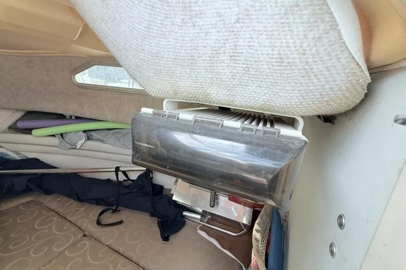 Slide: The Image of Interior of 2005 Grady-White Journey 258 boat, featuring seating and storage area. - 41