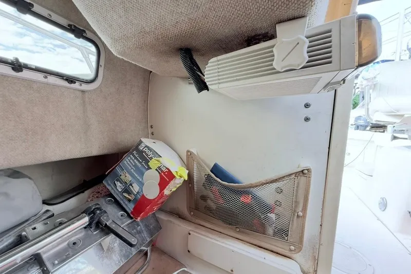 Slide: The Image of Interior of 2005 Grady-White Journey 258 boat with storage and equipment. - 45