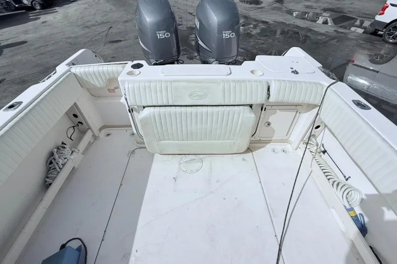 Slide: The Image of 2005 Grady-White Journey 258 boat deck with twin Yamaha 150 engines. - 46