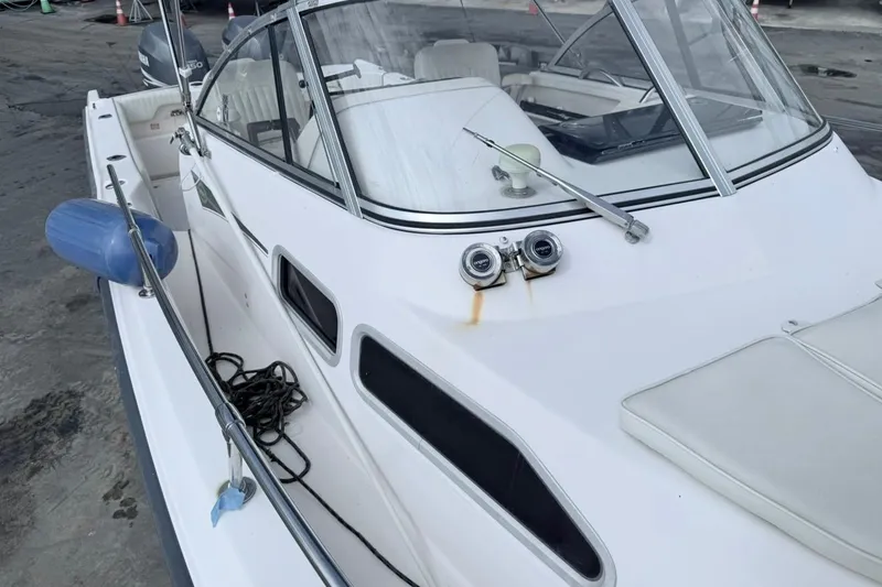 Slide: The Image of 2005 Grady-White Journey 258 boat with windshield and deck details. - 55