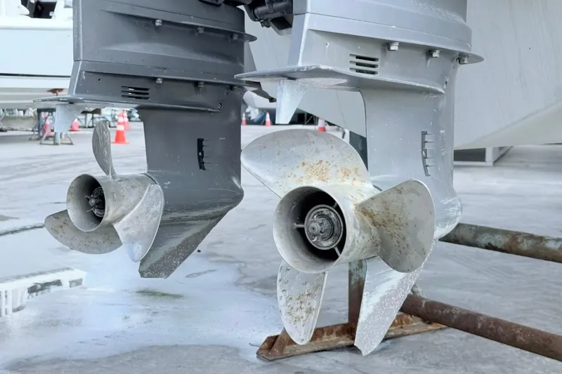 Slide: The Image of Twin outboard motors of a 2005 Grady-White Journey 258 boat on a trailer. - 57