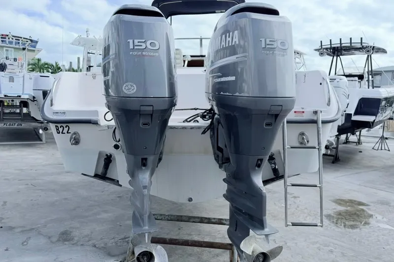 Slide: The Image of 2005 Grady-White Journey 258 boat with twin Yamaha 150 four-stroke engines. - 58