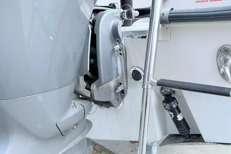 Slide: The Image of 2005 Grady-White Journey 258 boat engine and ladder detail. - 61