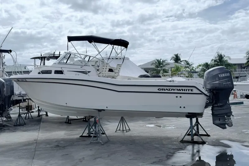 Slide: The Image of 2005 Grady-White Journey 258 boat with Yamaha outboard motor on stands. - 8