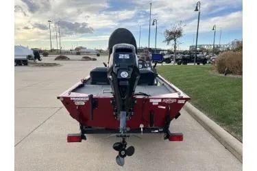 Slide: The Image of 2020 Tracker Pro 160 boat with 25 HP motor, parked outdoors. - 3