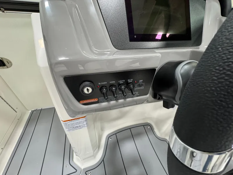 Slide: The Image of Dashboard of 2025 Chaparral 21 SSi boat with controls and steering wheel. - 16