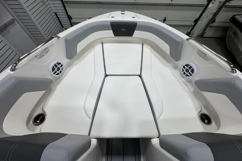 Slide: The Image of 2025 Chaparral 21 SSi boat interior with cushioned seating and cup holders. - 25