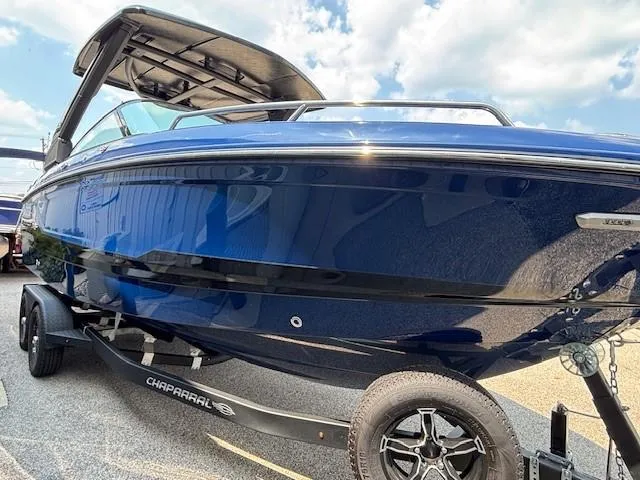 Slide: The Image of 2026 Chaparral SSX 6 boat on trailer, sleek blue design under sunny sky. - 10