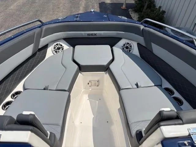 Slide: The Image of 2026 Chaparral SSX 6 boat interior with gray seating and cup holders. - 13