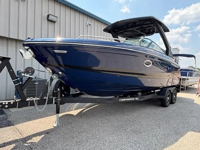 Slide: The Image of 2026 Chaparral SSX 6 boat on trailer, sleek design, blue exterior, parked outdoors. - 23