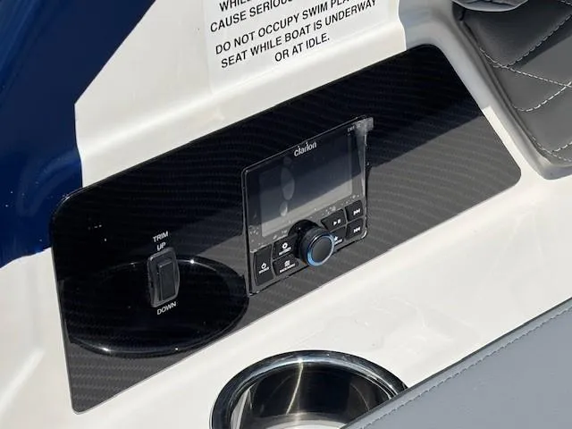 Slide: The Image of 2026 Chaparral SSX 6 boat dashboard with control panel and cup holder. - 30