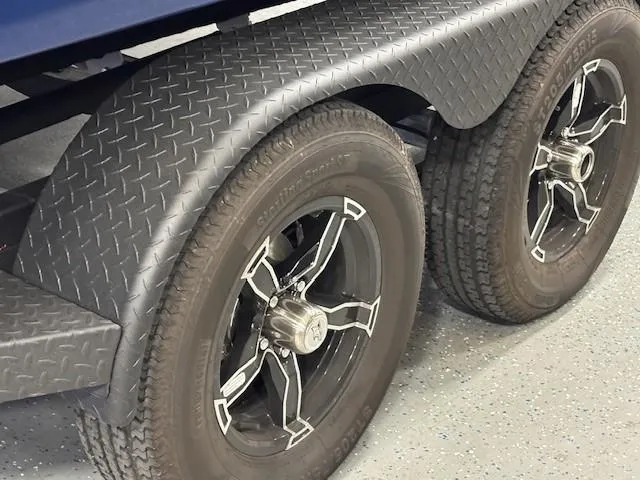 Slide: The Image of Trailer wheels of a 2026 Chaparral SSX 6 with diamond plate fenders. - 45