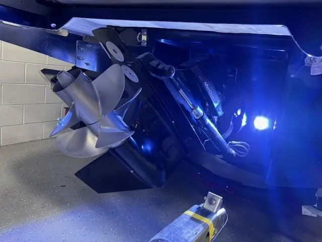 Slide: The Image of 2026 Chaparral SSX 6 boat propeller with blue LED lighting in a garage setting. - 52