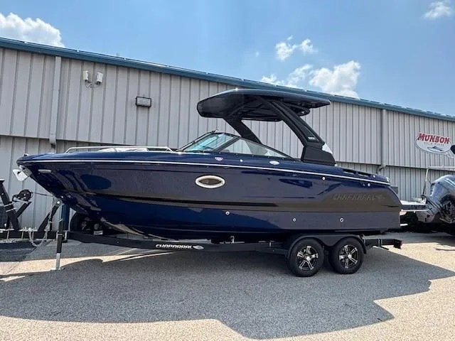 Slide: The Image of 2026 Chaparral SSX 6 boat on trailer, parked outdoors under clear sky. - 9