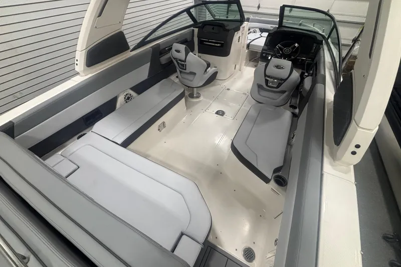 Slide: The Image of 2026 Chaparral 8 SSX boat interior with sleek seating and modern dashboard design. - 10