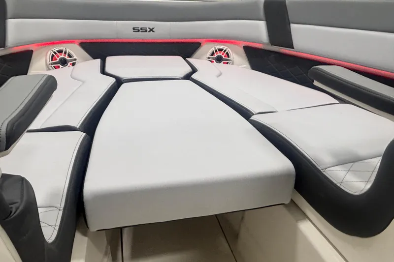 Slide: The Image of 2026 Chaparral 8 SSX boat interior with luxurious seating and modern speaker system. - 26